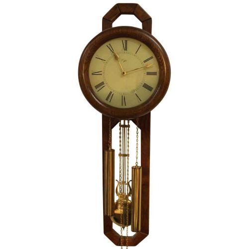 Wandklok met slinger en gewichten